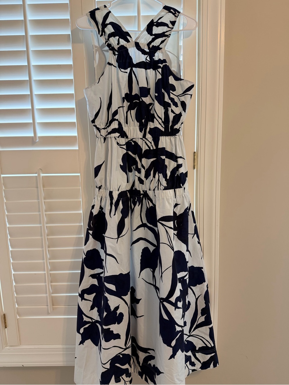 Sleeveless White tiered Dress with Navy Floral Print
